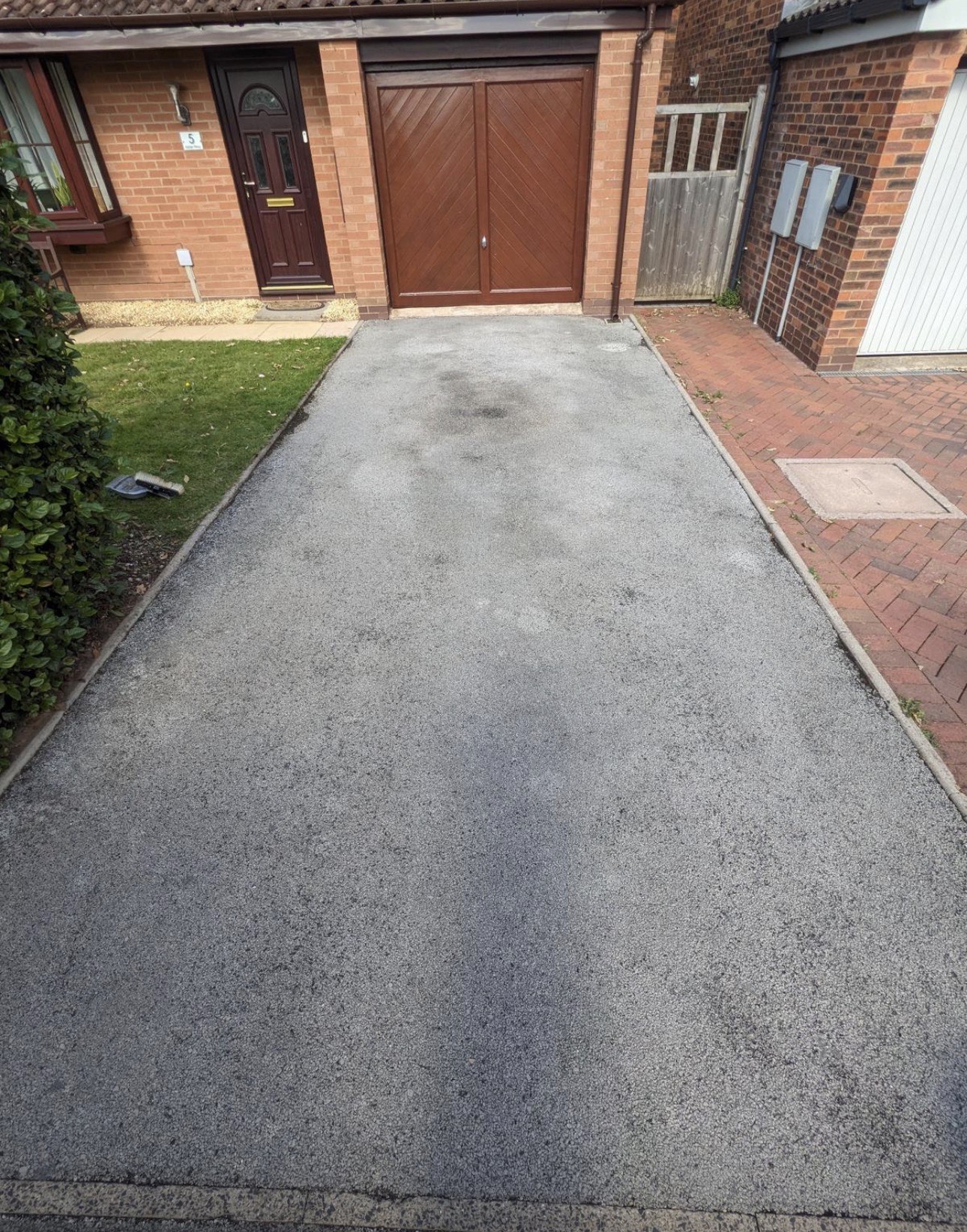 Tarmac driveway before cleaning — stained and discoloured