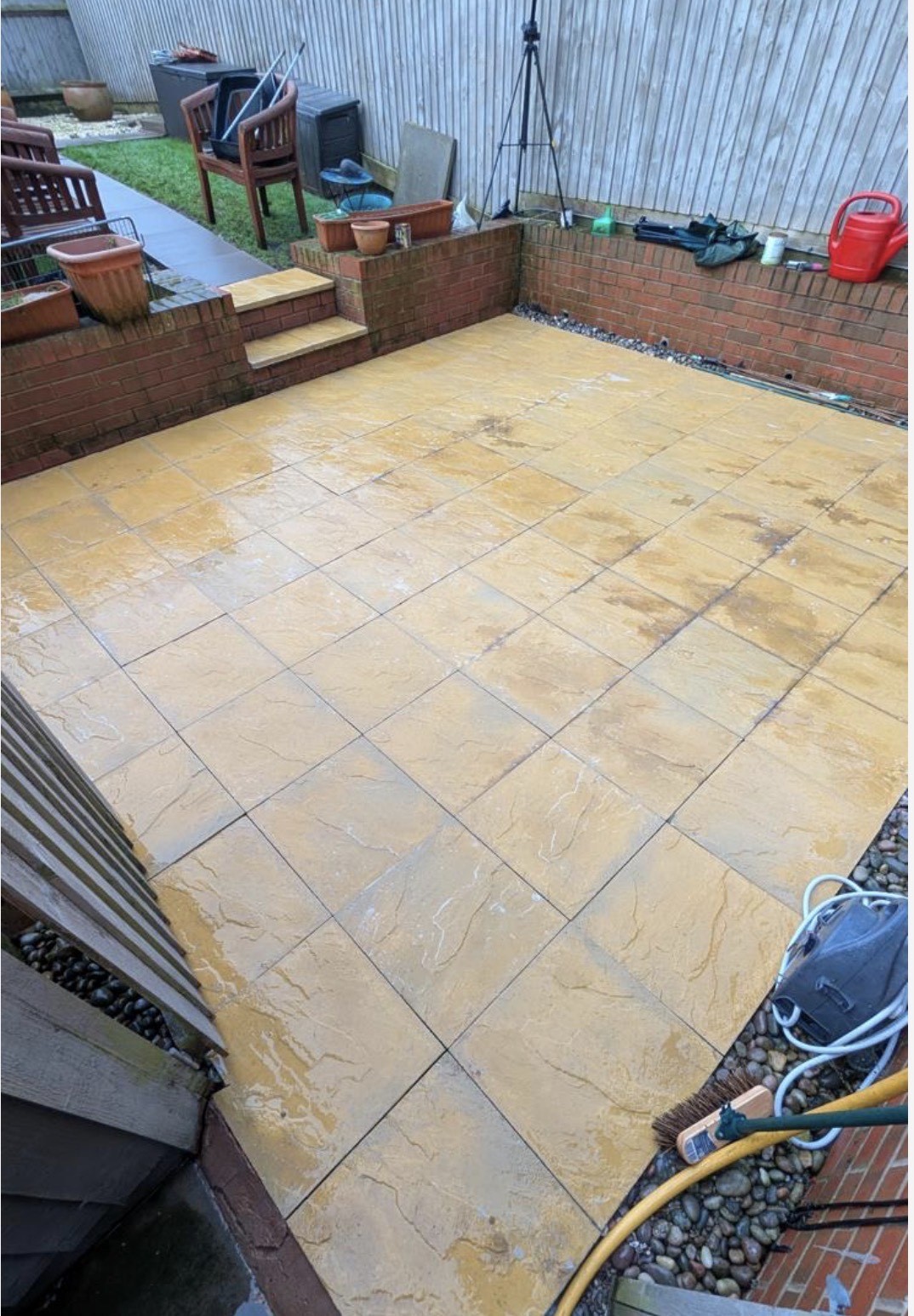Sandstone patio after cleaning — golden stone restored
